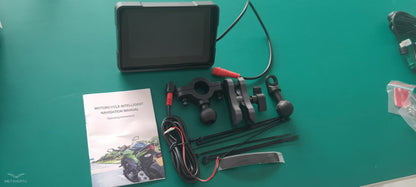 Complete set of a motorcycle wireless navigation device including monitor, mounting kit, and user manual.